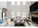 Bright and airy living room with a stone fireplace, and plush seating at 3989 Birkdale Dr, Carmel, IN 46033