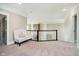 Upstairs loft area with decorative bench and views of stone accent wall at 3989 Birkdale Dr, Carmel, IN 46033