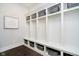 Well-organized mudroom features white shelving and dark hardwood floors at 3989 Birkdale Dr, Carmel, IN 46033