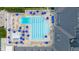 Aerial shot of pool with blue umbrellas and lounge chairs in a well-maintained community at 3989 Birkdale Dr, Carmel, IN 46033