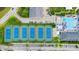 Aerial shot featuring multiple tennis courts adjacent to the community pool and clubhouse at 3989 Birkdale Dr, Carmel, IN 46033