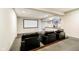 Home theater with tiered seating, projector screen, and custom lighting at 3989 Birkdale Dr, Carmel, IN 46033