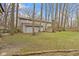 Expansive backyard with mature trees and a shed, perfect for outdoor activities at 4140 Melbourne Rd, Indianapolis, IN 46228