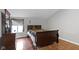 Inviting bedroom features wood floors, a sleigh bed, and ample natural light at 4140 Melbourne Rd, Indianapolis, IN 46228