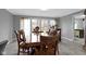Formal dining room with a large table, elegant chairs, and ample natural light at 4140 Melbourne Rd, Indianapolis, IN 46228