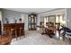 Dining room with marble floors, wooden bar, table and china cabinet at 4140 Melbourne Rd, Indianapolis, IN 46228