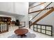 Grand foyer with high ceilings, elegant staircase, and stylish tile flooring at 4140 Melbourne Rd, Indianapolis, IN 46228