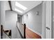 Upstairs hallway with hardwood floors and skylight at 4140 Melbourne Rd, Indianapolis, IN 46228