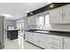 Kitchen with white cabinets and stainless steel appliances at 4140 Melbourne Rd, Indianapolis, IN 46228
