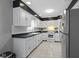 Kitchen featuring white cabinets and stainless steel appliances at 4140 Melbourne Rd, Indianapolis, IN 46228
