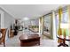 Spacious living room showcasing marble floors, an accent mirror, and bright lighting at 4140 Melbourne Rd, Indianapolis, IN 46228