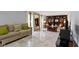Bright living room with marble floors, plush seating, and custom built-in shelving at 4140 Melbourne Rd, Indianapolis, IN 46228