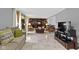 Cozy living room with built-in shelving, marble floors, and large windows at 4140 Melbourne Rd, Indianapolis, IN 46228