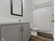 Bathroom with modern vanity, framed mirror, and shower with curtain at 4221 Millersville Rd, Indianapolis, IN 46205