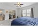 Bedroom with ceiling fan, natural light, adjacent office, and neutral carpet at 4221 Millersville Rd, Indianapolis, IN 46205