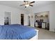 Bedroom features fan, natural light, adjacent closet, and built-in desk at 4221 Millersville Rd, Indianapolis, IN 46205