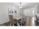 Formal dining room features modern light fixture and seating for six at 4221 Millersville Rd, Indianapolis, IN 46205