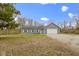 Charming single-story home featuring vinyl siding, solar panels and an attached two car garage at 4221 Millersville Rd, Indianapolis, IN 46205