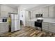 Well-appointed kitchen featuring modern appliances, gray cabinets, and efficient storage at 4221 Millersville Rd, Indianapolis, IN 46205