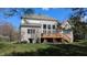 A view of the brick home exterior with a wooden deck and large windows at 452 Twin Oaks Dr, Carmel, IN 46032