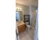 Bathroom featuring neutral tile, a single vanity, and a glass shower at 452 Twin Oaks Dr, Carmel, IN 46032