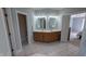 Spacious bathroom featuring double vanity, walk-in closet, private toilet room, and tiled floor at 452 Twin Oaks Dr, Carmel, IN 46032