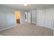 Bedroom with neutral carpet, an en-suite bathroom, and large closets at 452 Twin Oaks Dr, Carmel, IN 46032