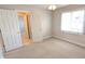 Bedroom with carpet, large window, neutral walls, and en-suite bathroom at 452 Twin Oaks Dr, Carmel, IN 46032