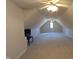 Large, versatile bonus room with a high ceiling, carpet, and a ceiling fan at 452 Twin Oaks Dr, Carmel, IN 46032
