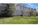 Exterior view of a home featuring lush green lawns and mature trees at 452 Twin Oaks Dr, Carmel, IN 46032
