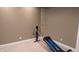 Finished basement workout area showcasing space for gym equipment in the recreation area at 452 Twin Oaks Dr, Carmel, IN 46032