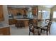 Spacious kitchen featuring wood cabinets, granite countertops, stainless steel appliances and tiled floors at 452 Twin Oaks Dr, Carmel, IN 46032