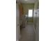 Functional laundry room with stacked washer/dryer and storage cabinets offers convenience and organization at 452 Twin Oaks Dr, Carmel, IN 46032
