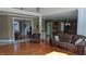 Elegant living room features hardwood floors, fireplace, and views into adjacent rooms at 452 Twin Oaks Dr, Carmel, IN 46032