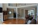 Spacious living room with hardwood floors, fireplace, and views into adjacent rooms at 452 Twin Oaks Dr, Carmel, IN 46032