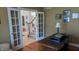 Bright office with French doors, hardwood floors, and elegant furnishings at 452 Twin Oaks Dr, Carmel, IN 46032