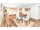 Basement dining area with a wooden table and chairs, adjacent to a cozy seating area at 4625 Berkshire Ln, Indianapolis, IN 46226