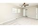 Neutral bedroom features a ceiling fan, plush carpet, and bright natural light at 4625 Berkshire Ln, Indianapolis, IN 46226