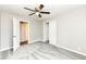 Neutral bedroom features a ceiling fan, plush carpet, walk in closet, and an en suite bathroom at 4625 Berkshire Ln, Indianapolis, IN 46226