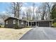 A beautiful brown home featuring a new driveway and an attached garage at 4625 Berkshire Ln, Indianapolis, IN 46226