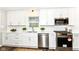 Bright kitchen featuring stainless steel appliances, sleek white cabinets, and quartz countertops at 4625 Berkshire Ln, Indianapolis, IN 46226