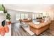 Bright living area with a fireplace and an open floor plan into dining and kitchen at 4625 Berkshire Ln, Indianapolis, IN 46226