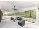 Covered patio with ceiling fan and stylish furniture for outdoor entertaining at 4625 Berkshire Ln, Indianapolis, IN 46226