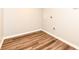 Empty room with wood floors and white base trim ready to customize as your own at 4625 Berkshire Ln, Indianapolis, IN 46226