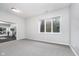 Finished basement with a window, neutral carpet, and access to the gym at 519 Southwind, Brownsburg, IN 46112