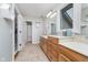 Well-lit bathroom features double sinks, a large mirror, and lots of storage, perfect for a busy household at 519 Southwind, Brownsburg, IN 46112