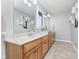 Bright bathroom features double sinks, a large mirror, and ample counter space for your convenience at 519 Southwind, Brownsburg, IN 46112