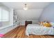 Bright bedroom with built-in shelving and a cozy window seat and hardwood floors at 519 Southwind, Brownsburg, IN 46112