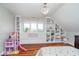 Bedroom featuring built-in shelving and hardwood floors at 519 Southwind, Brownsburg, IN 46112