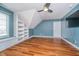 Bonus room featuring built in bookshelves and wood floors, creating a cozy and functional living space at 519 Southwind, Brownsburg, IN 46112